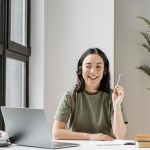 woman-with-headset-having-video-call-laptop-1024×683